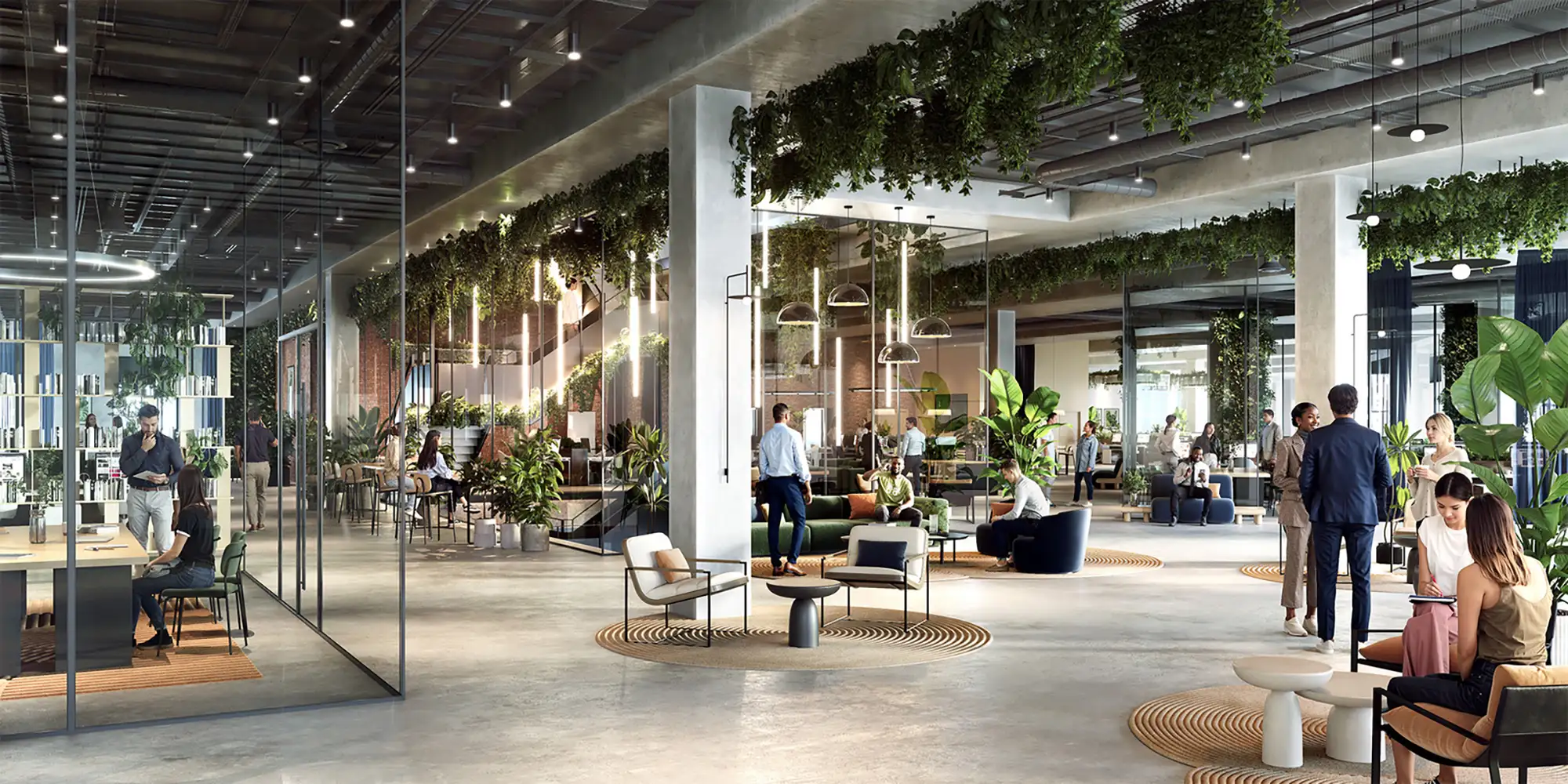 Modern office interior with glass-walled offices, hanging plants, and people working and conversing in a common area.
