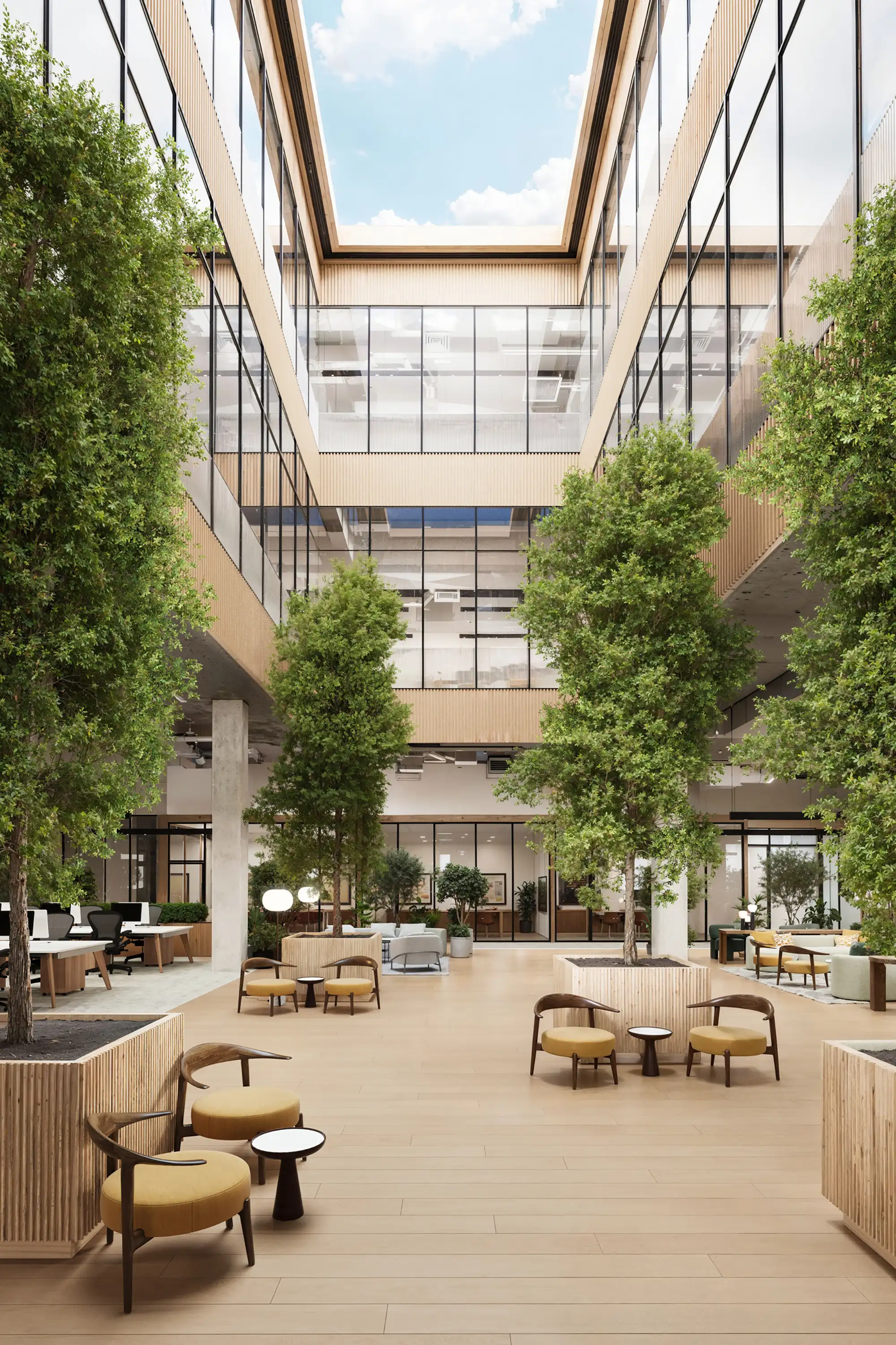 A spacious modern office with glass walls, wood finishes, lush greenery, skylights, mezzanine offices, and bright seating areas.